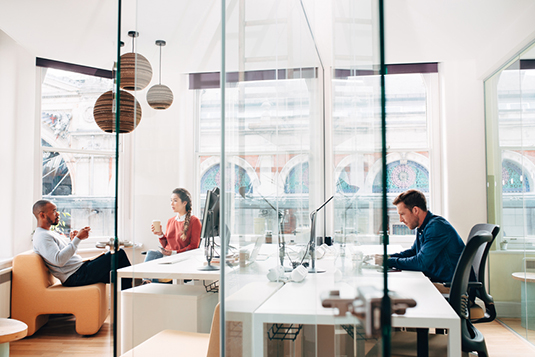 Business people working in busy office space